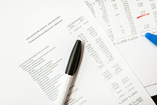 Financial documents featuring cash flows and pens, ideal for business themes and analysis.